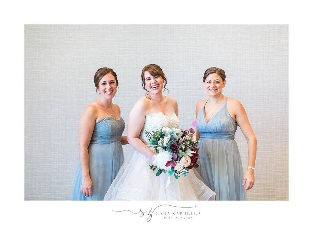 bride and bridesmaids in blue smile for Sara Zarrella Photography