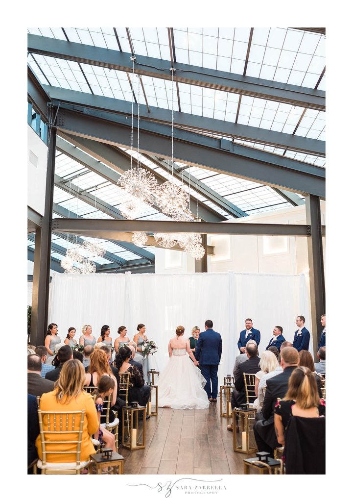 Crowne Plaza wedding ceremony in atrium with Sara Zarrella Photography