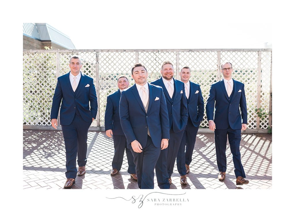 groomsmen pose for Sara Zarrella Photography at Crowne Plaza
