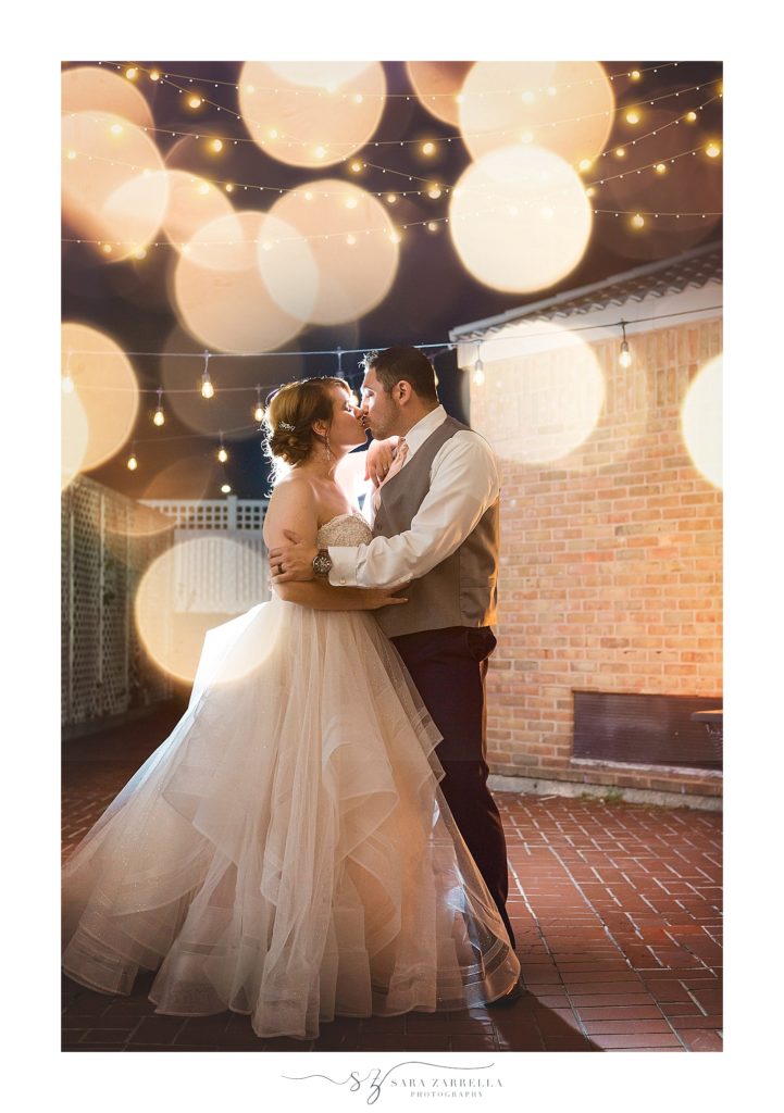romantic night portraits on the patio at the Warwick Crowne Plaza photographed by Sara Zarrella Photography