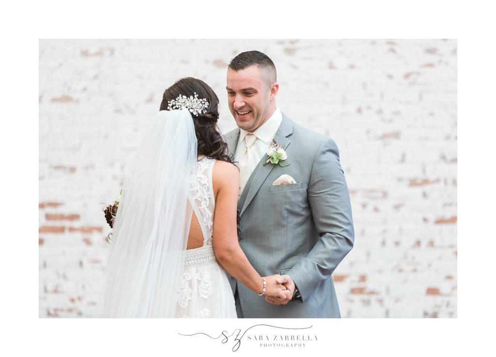 Sara Zarrella Photography captures bride and groom during first look at Crowne Plaza 