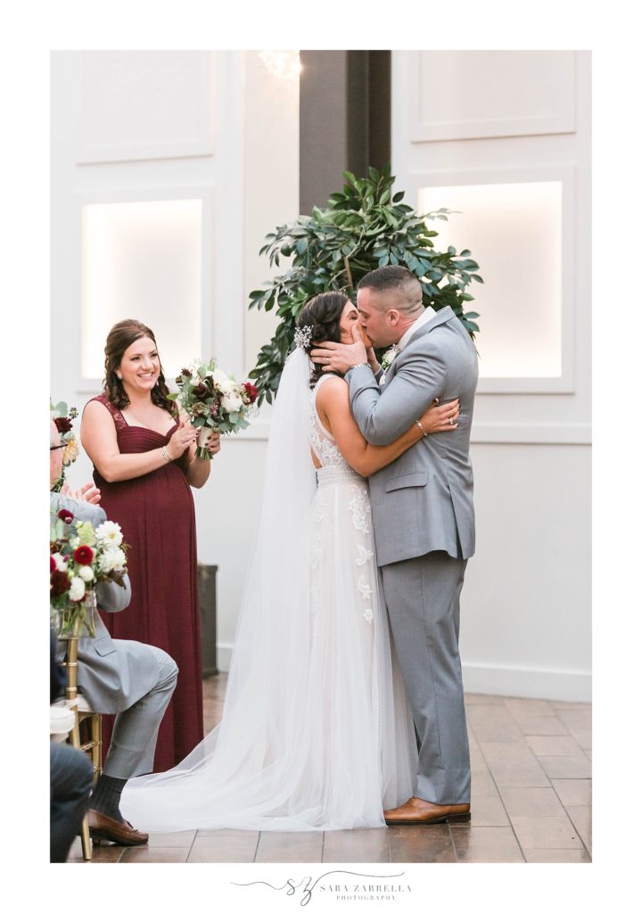 Sara Zarrella Photography captures first kiss at modern Crowne Plaza wedding