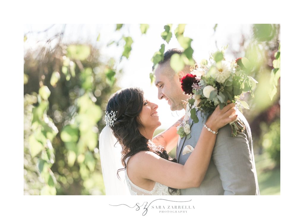 Sara Zarrella Photography photographs newlyweds in trees at Crowne Plaza