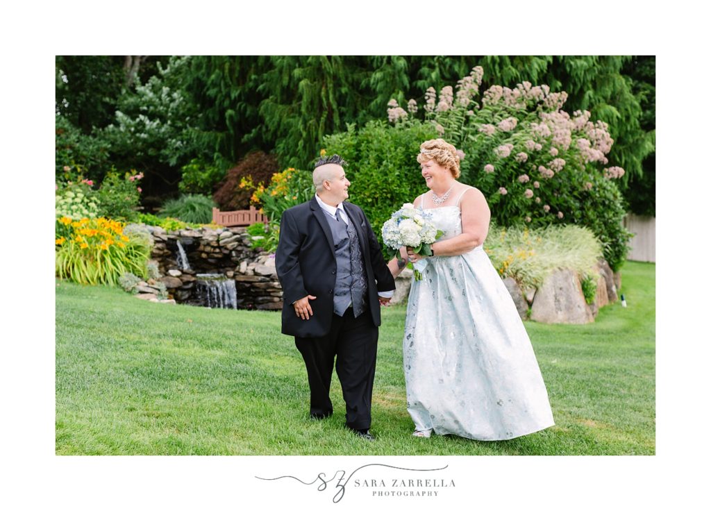 couple laughs during wedding portraits at Kirkbrae Country Club