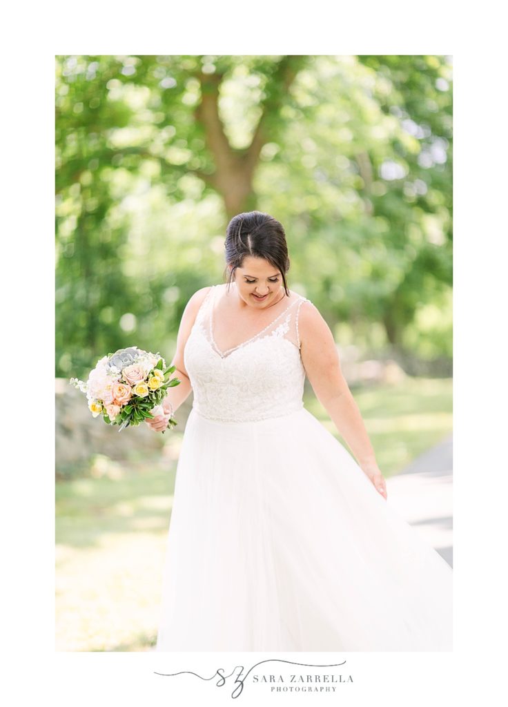 bride twirls wedding gown in Rhode Island
