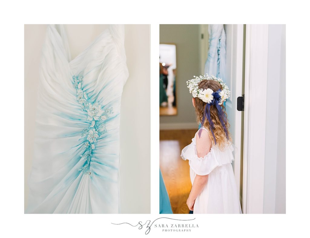 bride's wedding gown with blue details and flower girl watching bride prepare