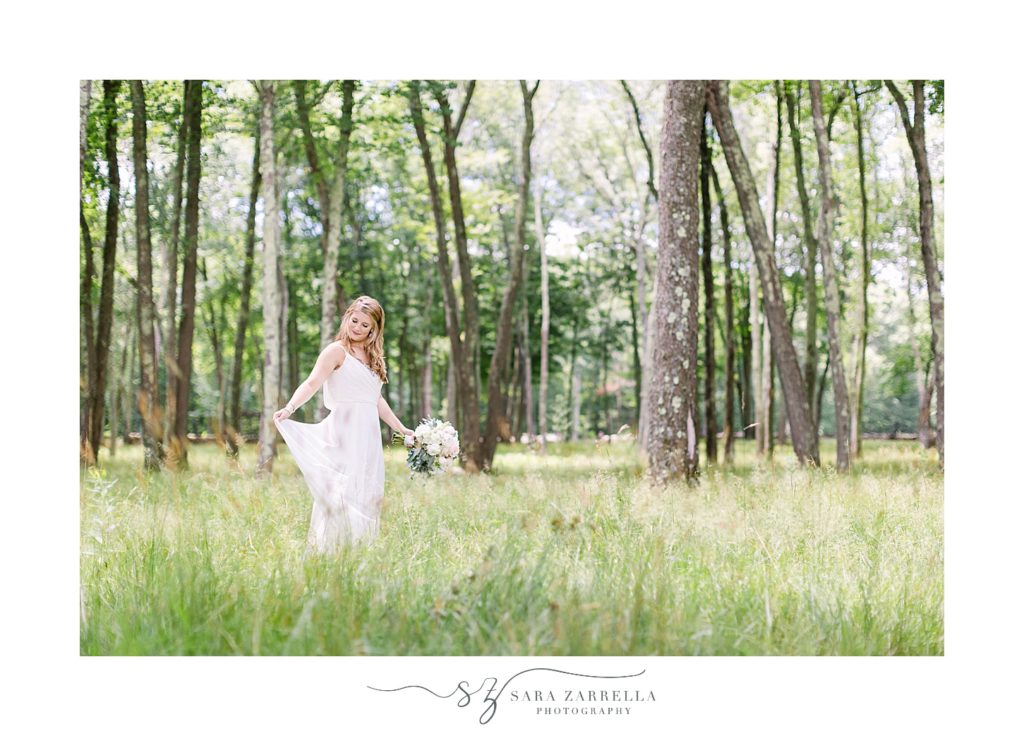 bride poses in the woods of Gerald's Farm