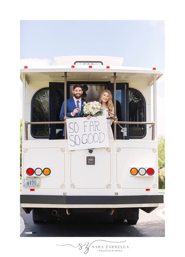 bride and groom pose on RI trolley