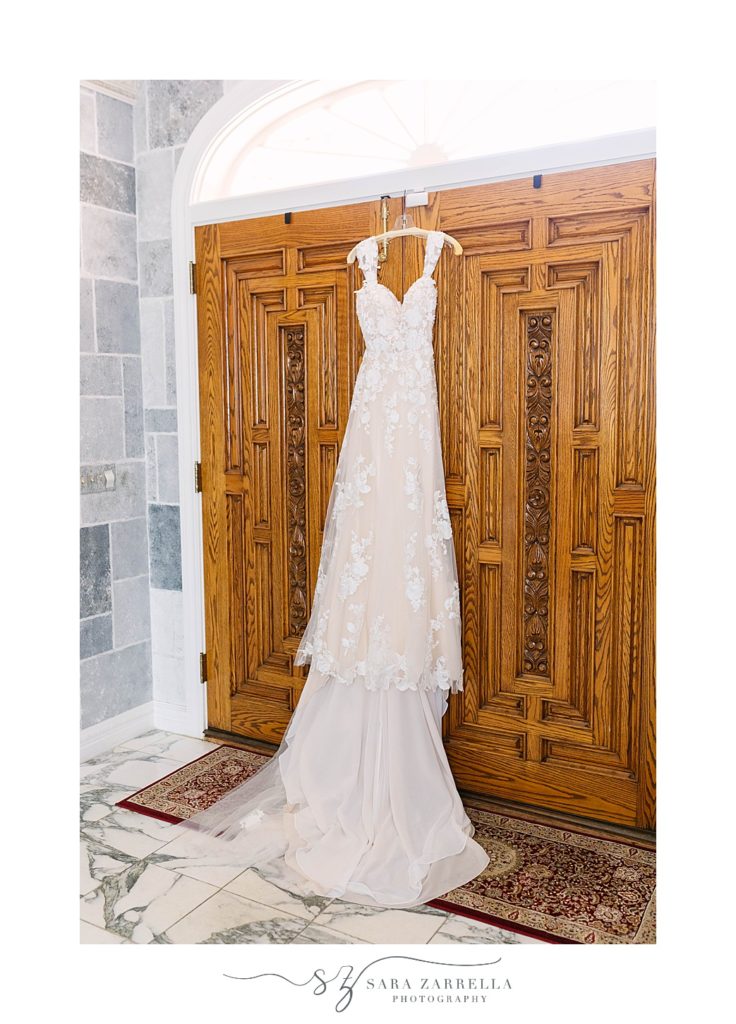bride's dress hangs on doors of private home in Newport RI