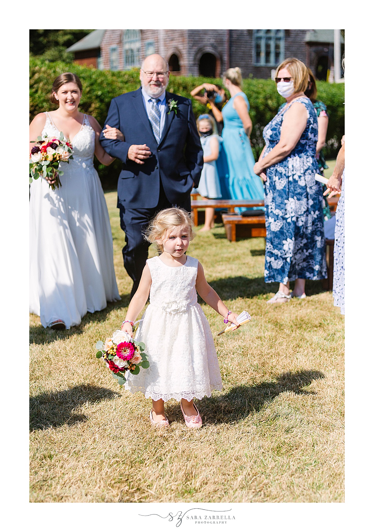 bride and groom's daughter walks up aisle