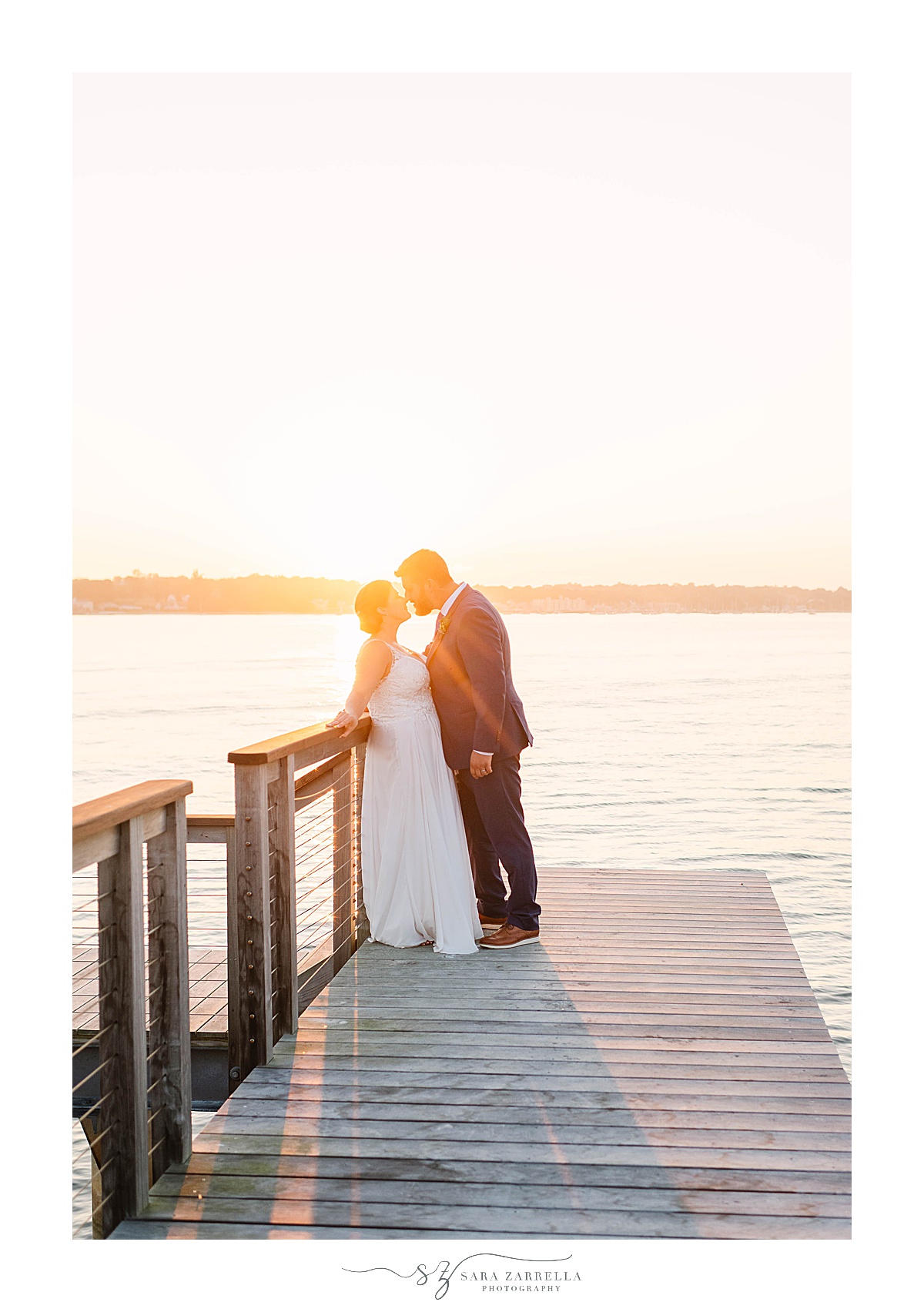 sunset wedding portraits on dock in Groton CT
