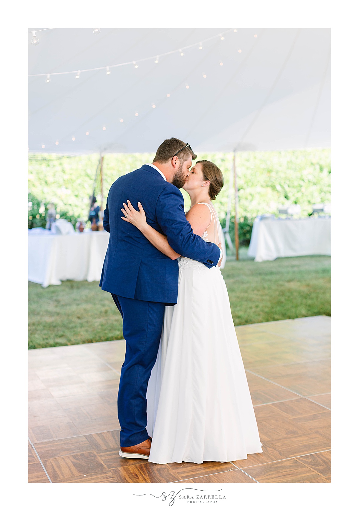 bride and groom kiss during first dance in Connecticut