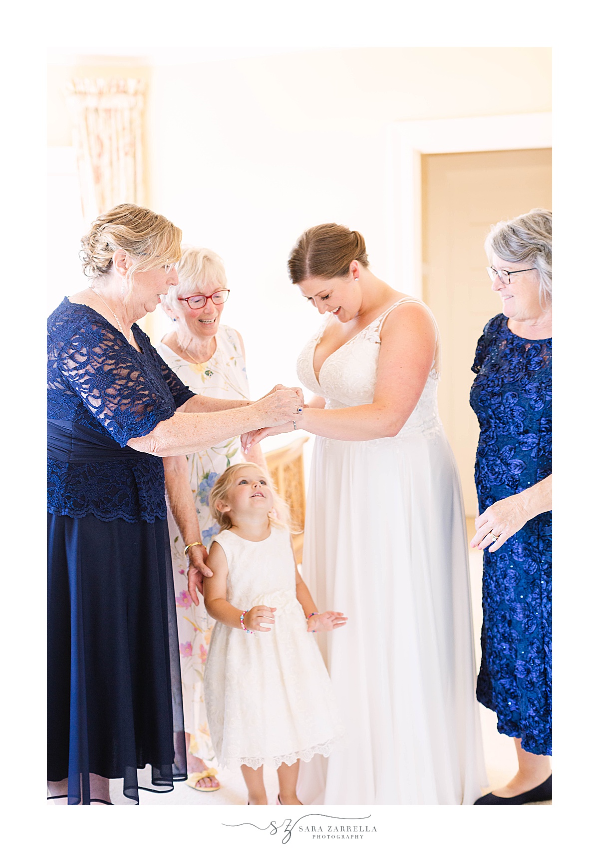 bride gets ready for CT wedding with daughter, mother and grandmother