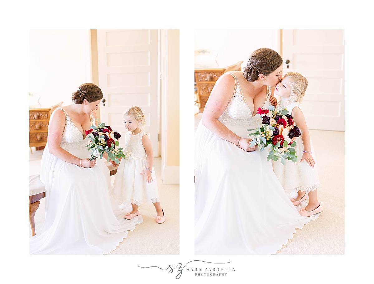 bride kisses daughter during wedding prep