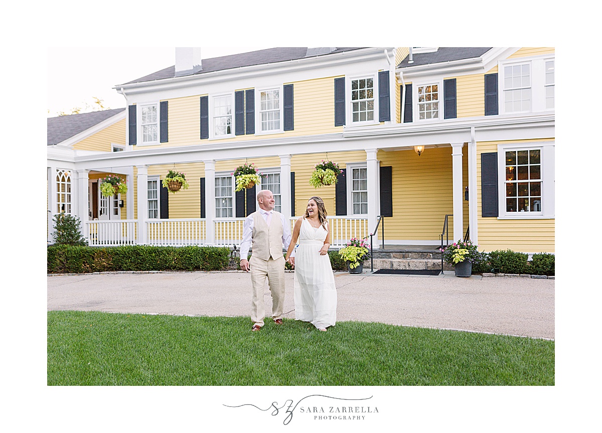 newlyweds walk through Rhode Island venue with Sara Zarrella Photography