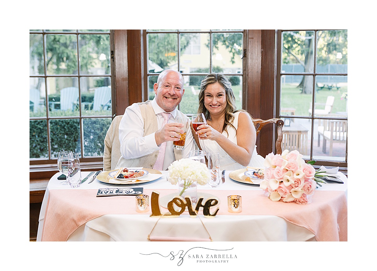 newlyweds toast at Agawam Hunt Country Club Wedding