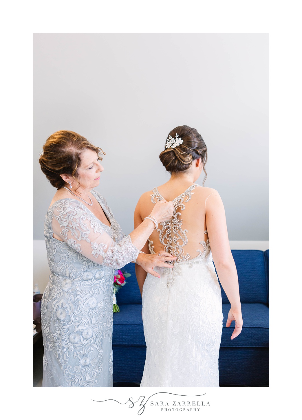 mom adjusts bride's gown before Blithewold Mansion Wedding