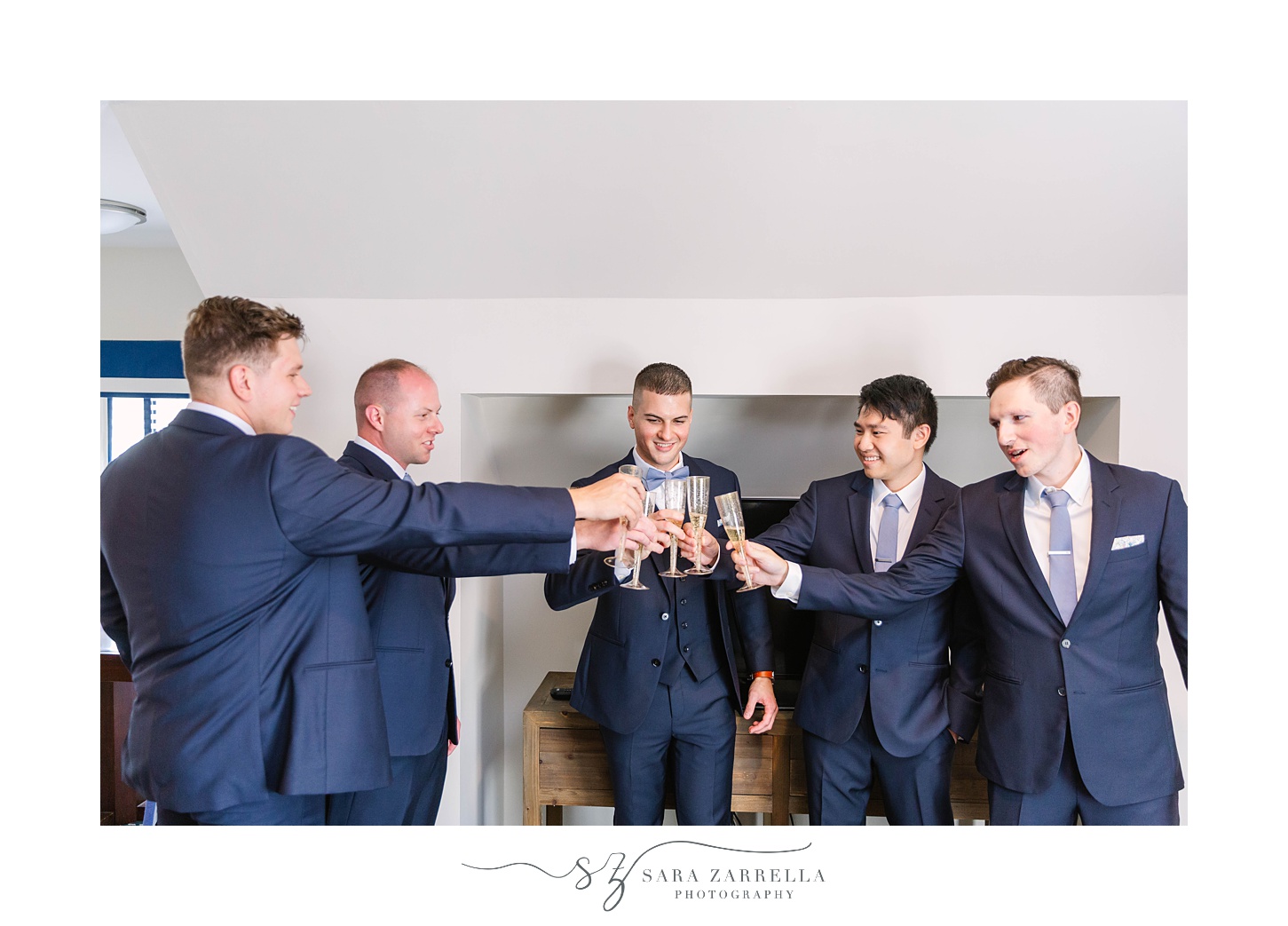 groom and groomsmen toast on wedding morning