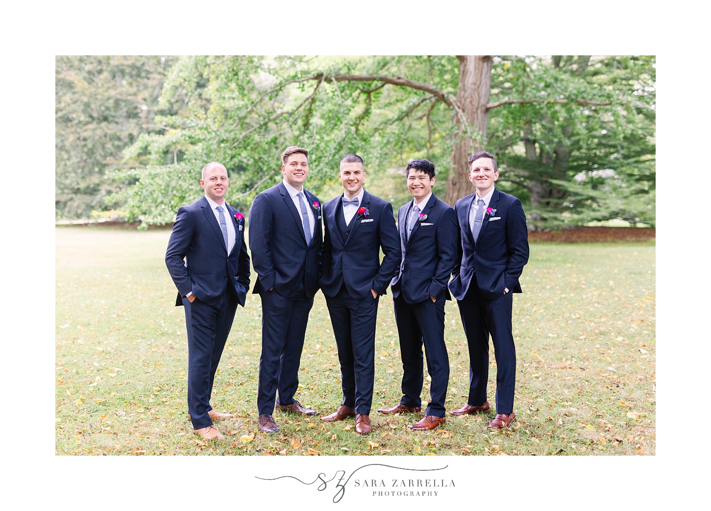 groom poses with groomsmen at Blithewold Mansion