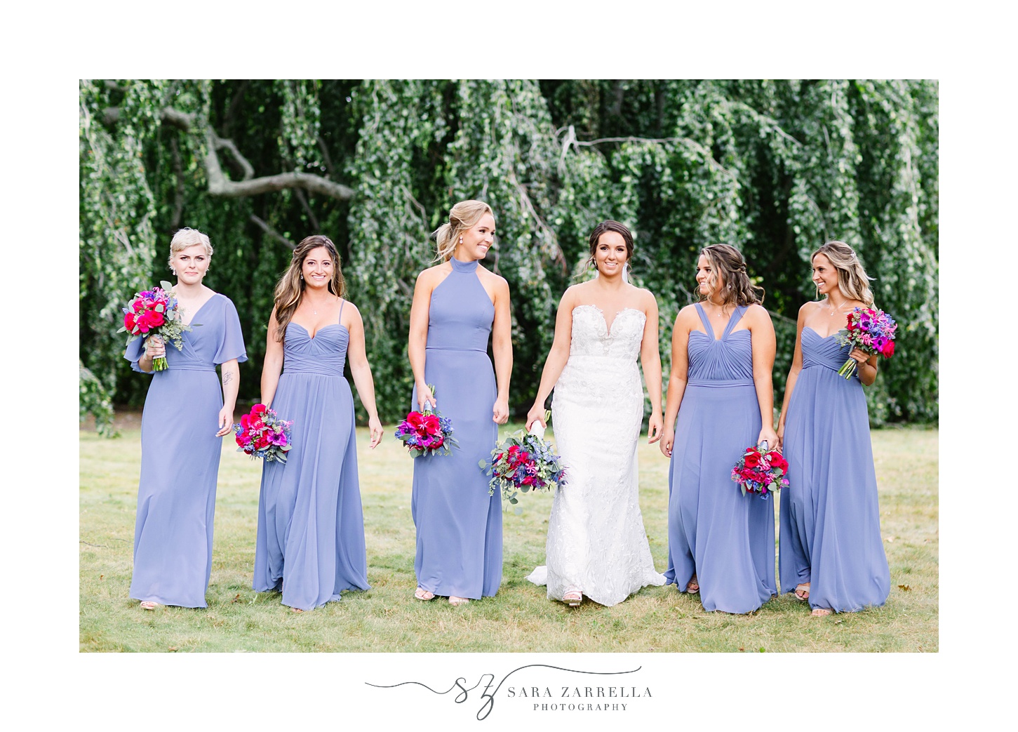 bridesmaids walk with bride at Blithewold Mansion