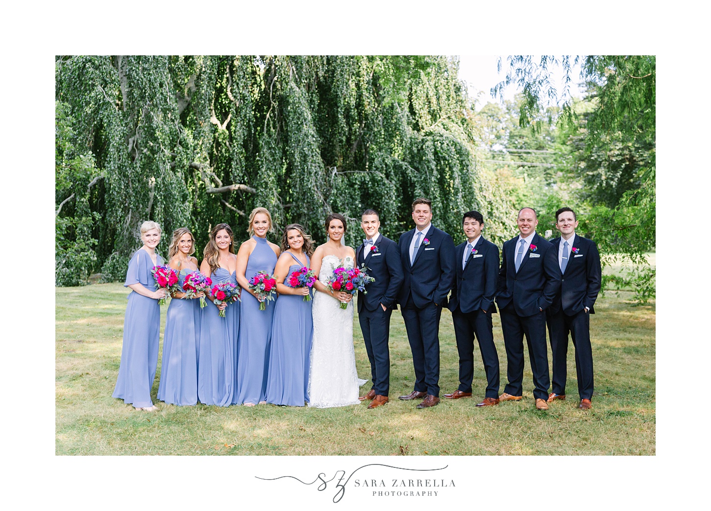 bridal party stands with bride and groom during RI wedding portraits