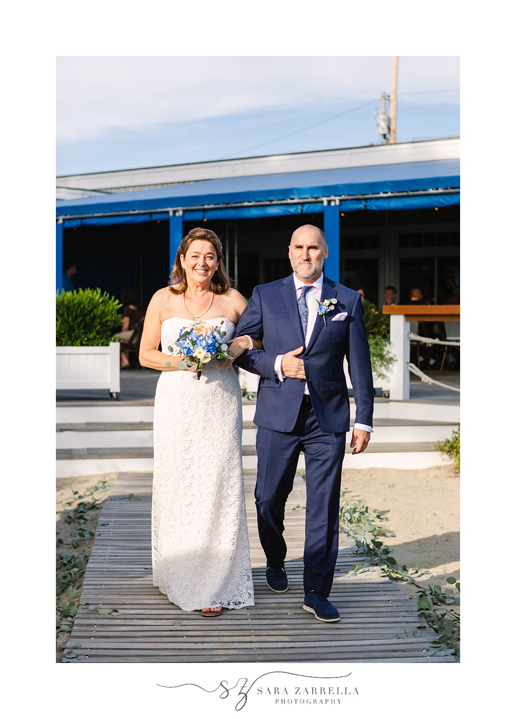 bride and groom walk down aisle at Iggy's Boardwalk