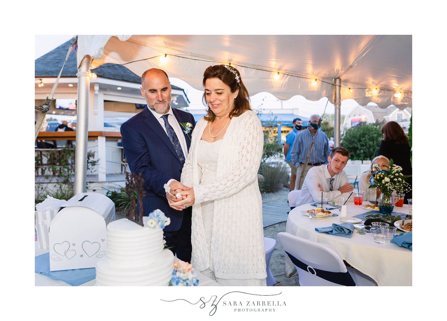 bride and groom cut wedding cake in Rhode Island