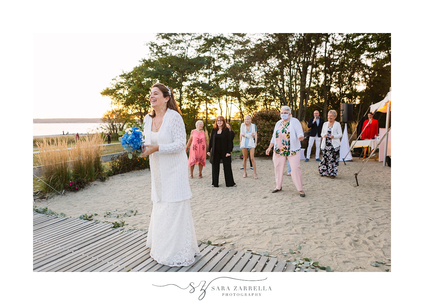 bride throws bouquet during Iggy's Boardwalk wedding reception