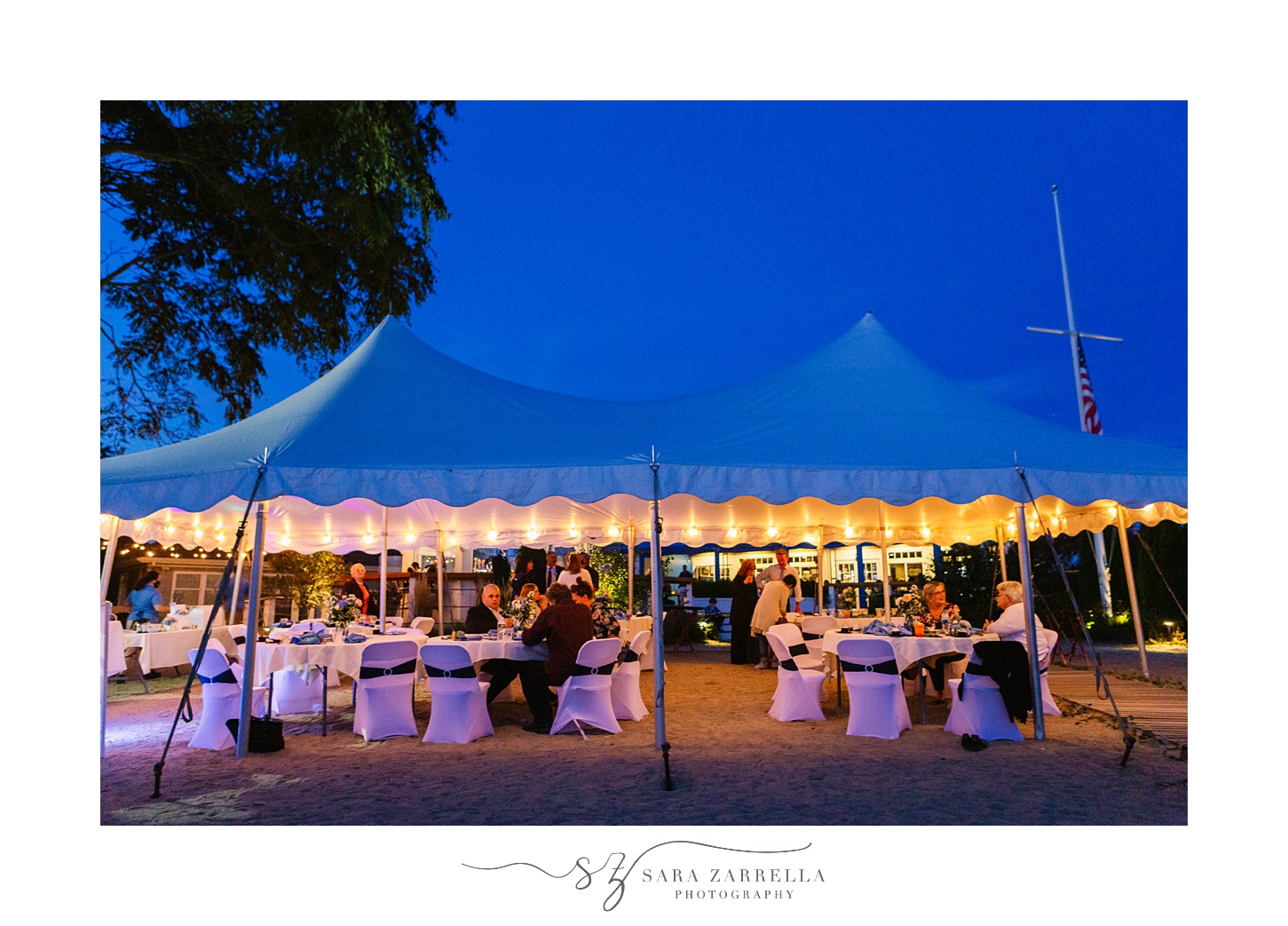 nighttime wedding under tent at Iggy's Boardwalk