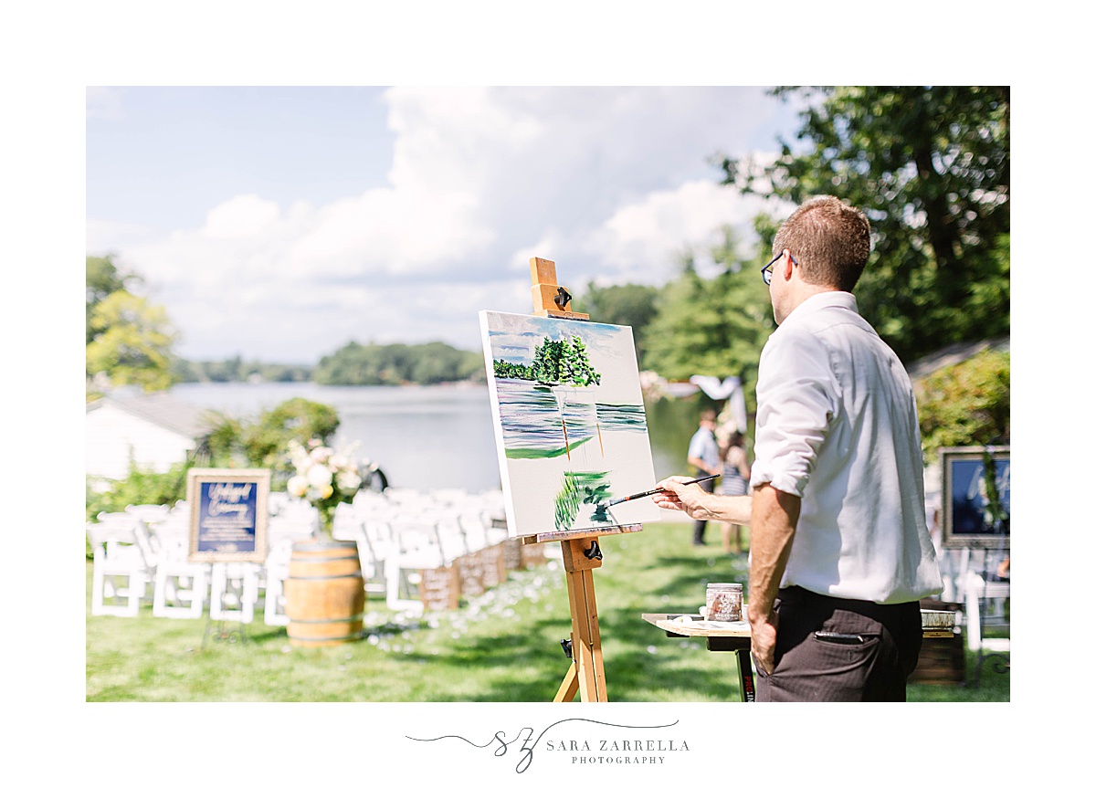 live painter paints waterfront ceremony setup in Rhode Island