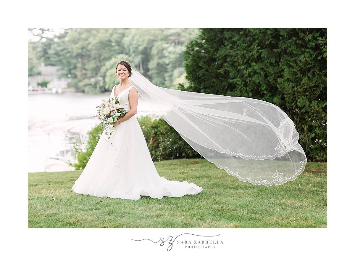 bride poses with veil floating behind her