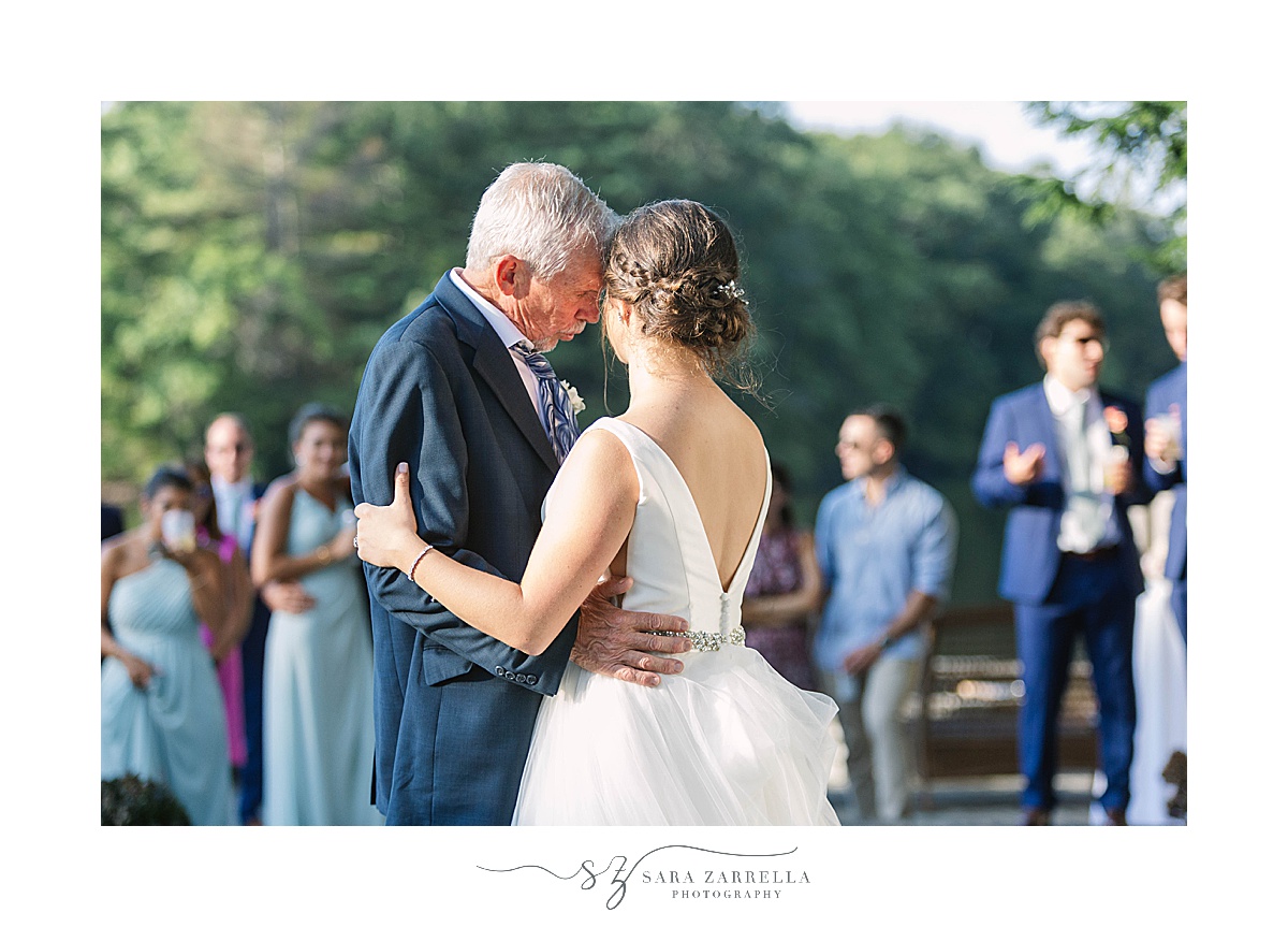 bride dances with dad during reception
