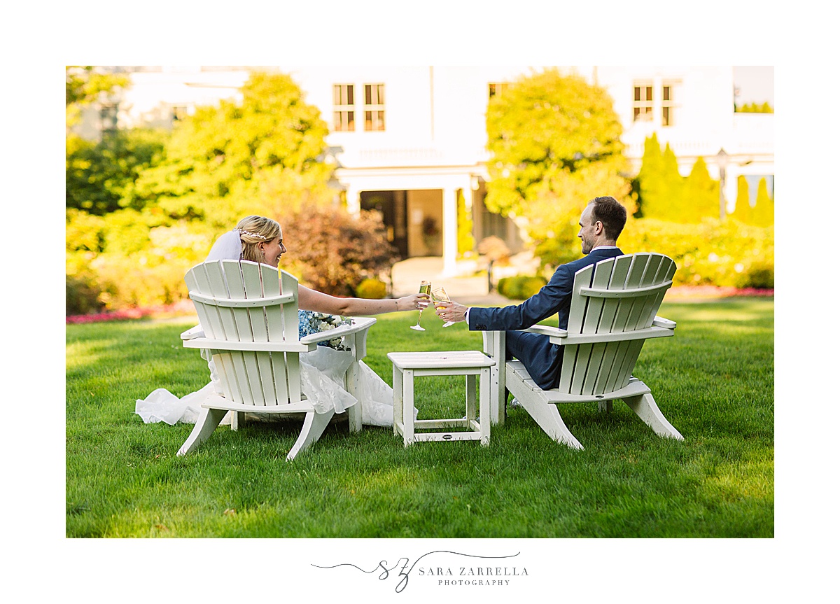 bride and groom sit in chairs looking at The Chanler at Cliff Walk