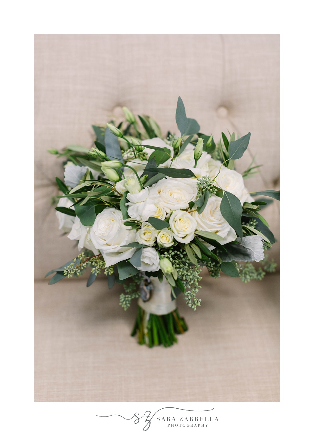 bride's bouquet of white flowers and greenery