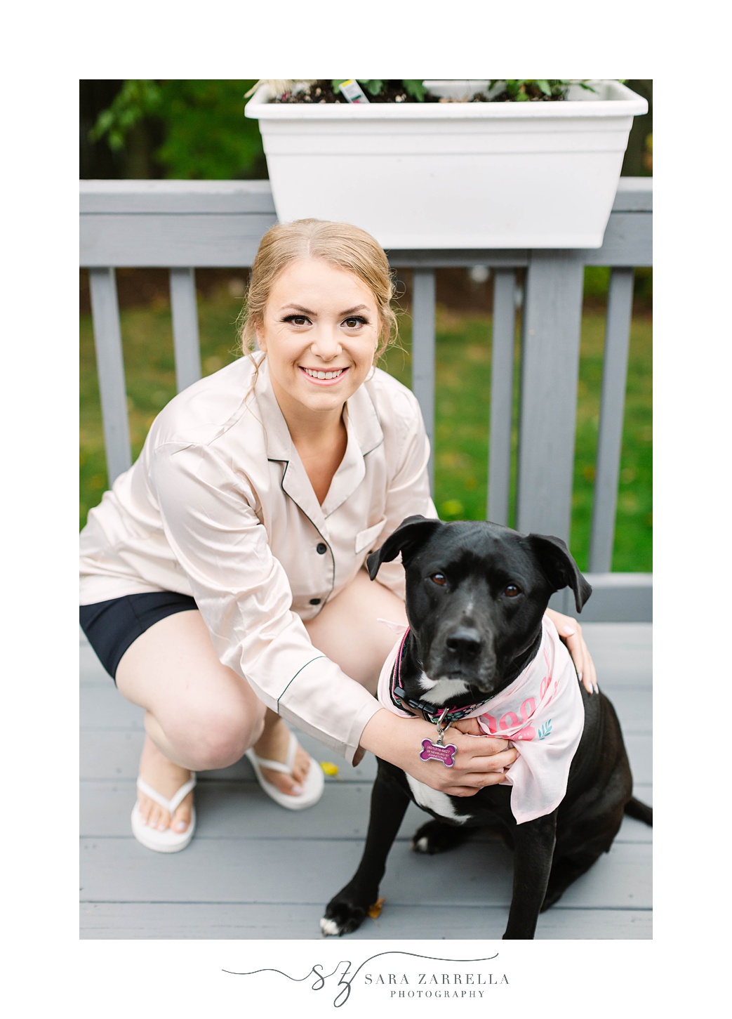 bride poses with dog before Rhode Island wedding day