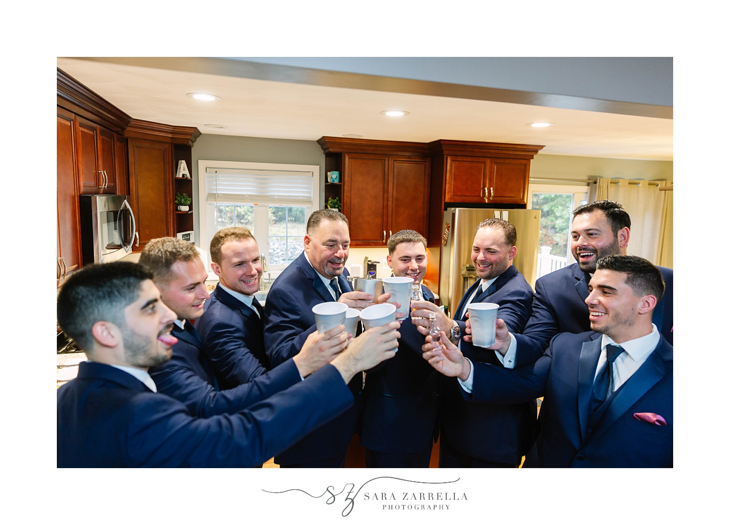 groom and groomsmen toast before RI wedding