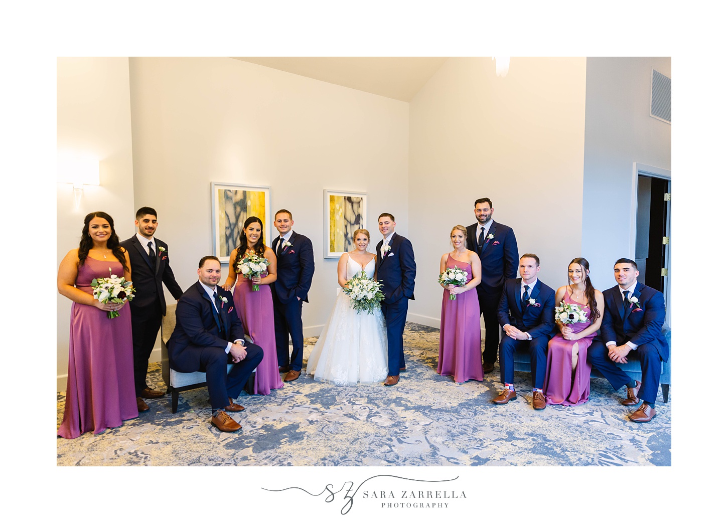 wedding party poses in lobby of Rhode Island venue