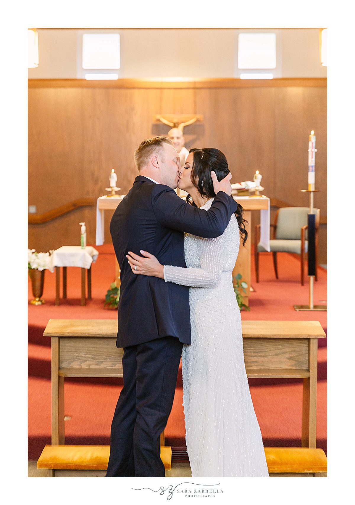 newlyweds kiss during traditional church wedding