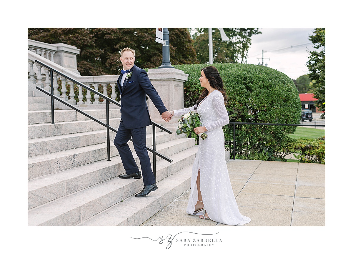 bride and groom walk up steps at Chapel