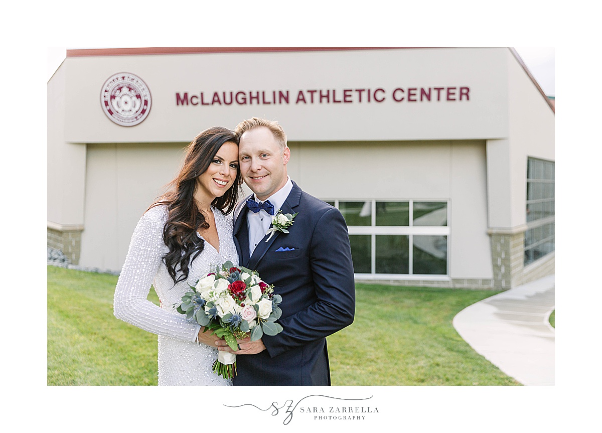 bride and groom pose outside La Salle Academy Chapel athletic center
