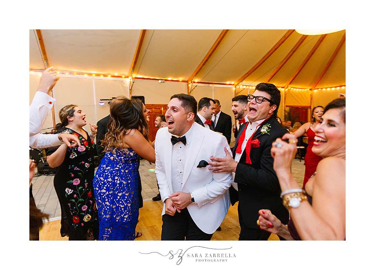groom dances during Bohlin wedding reception