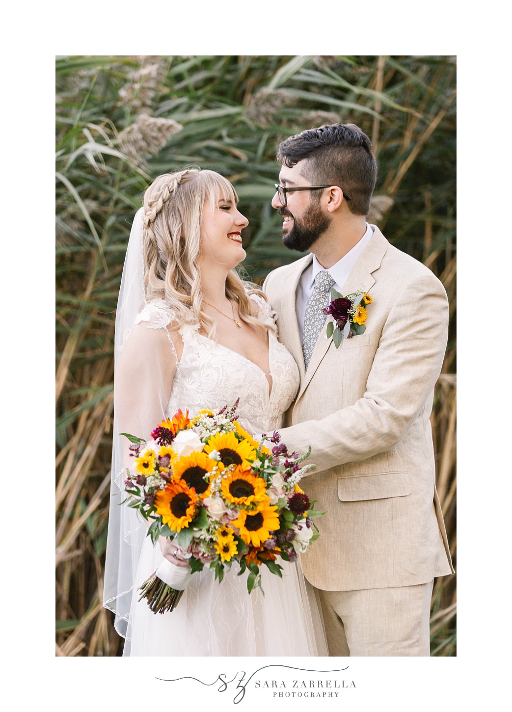 newlyweds laugh during wedding photos