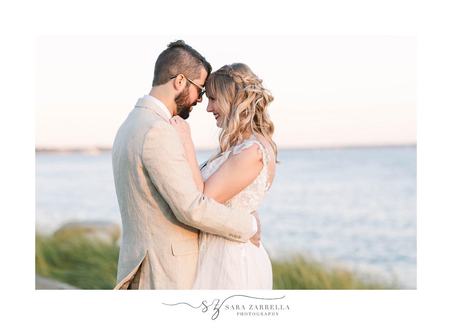 bride and groom stand together at sunset in Warwick RI