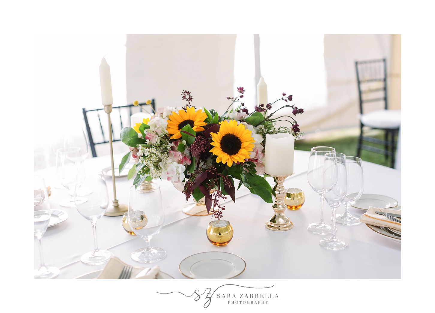 tented wedding reception with sunflower centerpieces