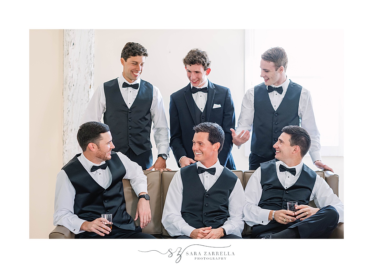 groom and groomsmen pose at Blithewold Mansion