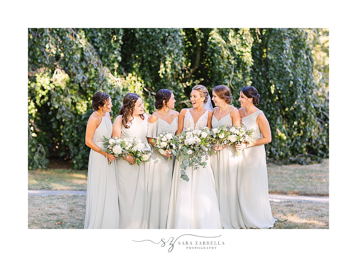 bride and bridesmaids pose at Blithewold Mansion