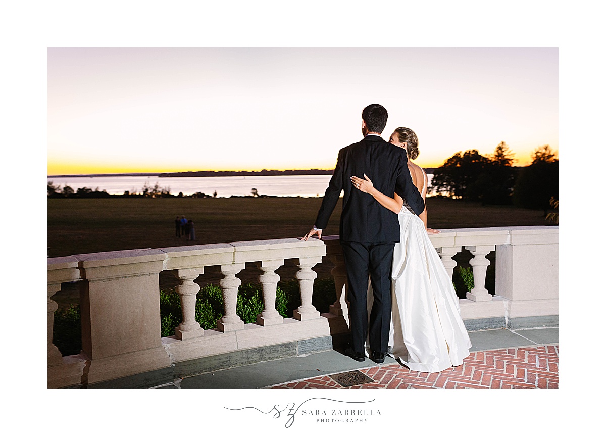 sunset wedding portraits overlooking bay at Blithewold Mansion