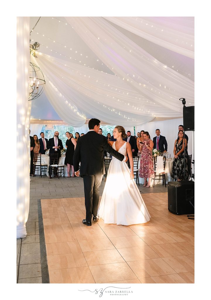 first dance during tented wedding reception