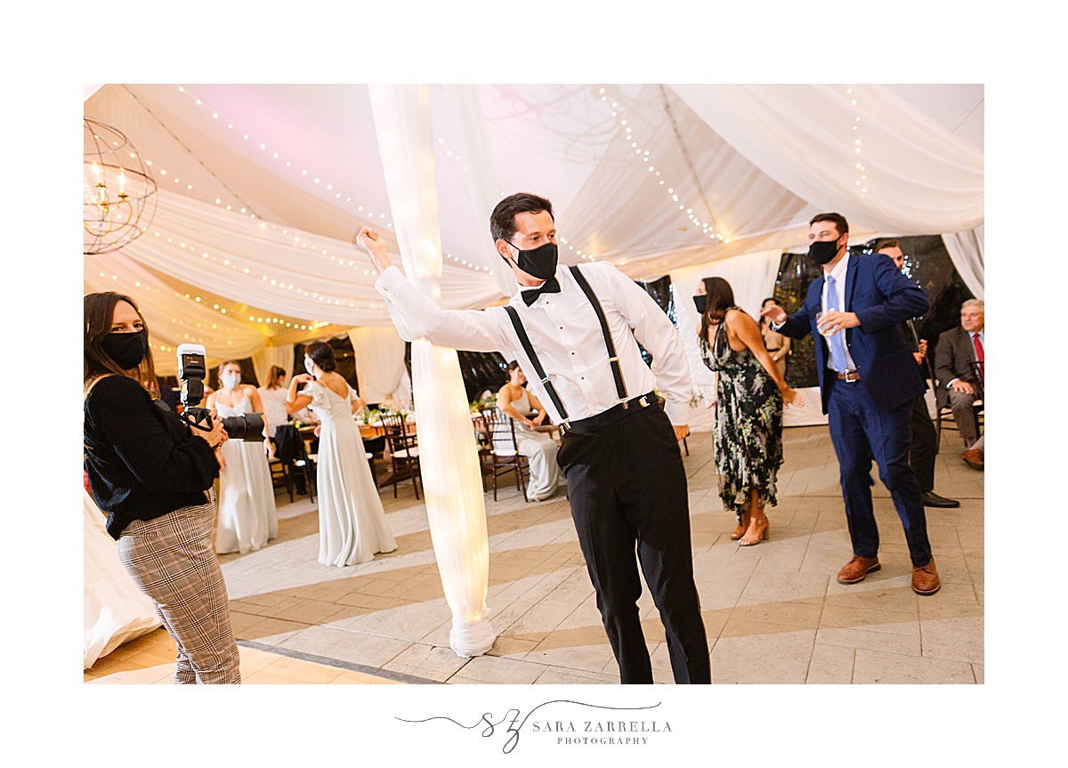 groom dances with mask on