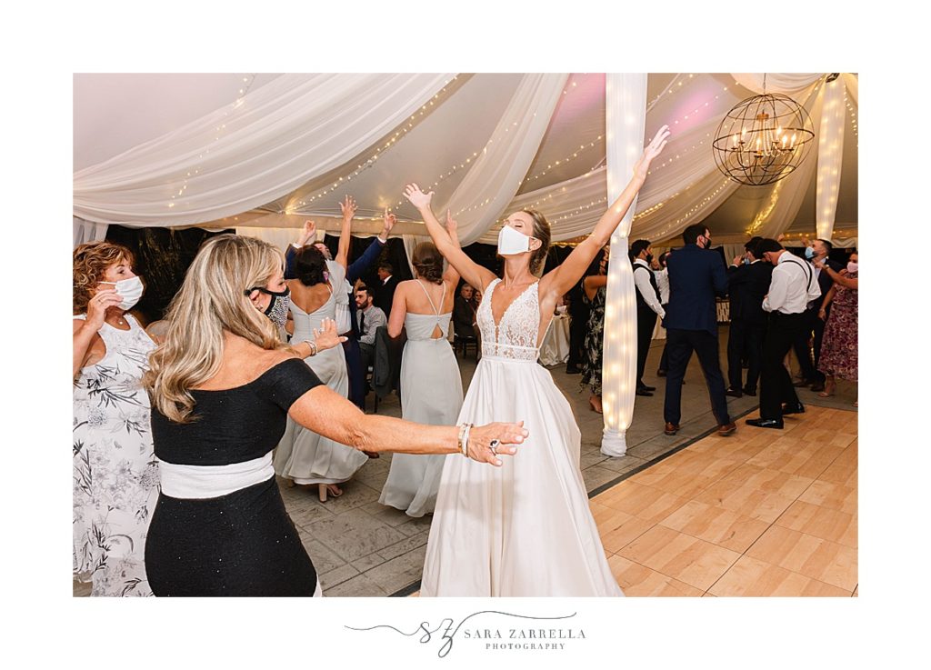 bride dances with mask on during COVID-19 safe reception